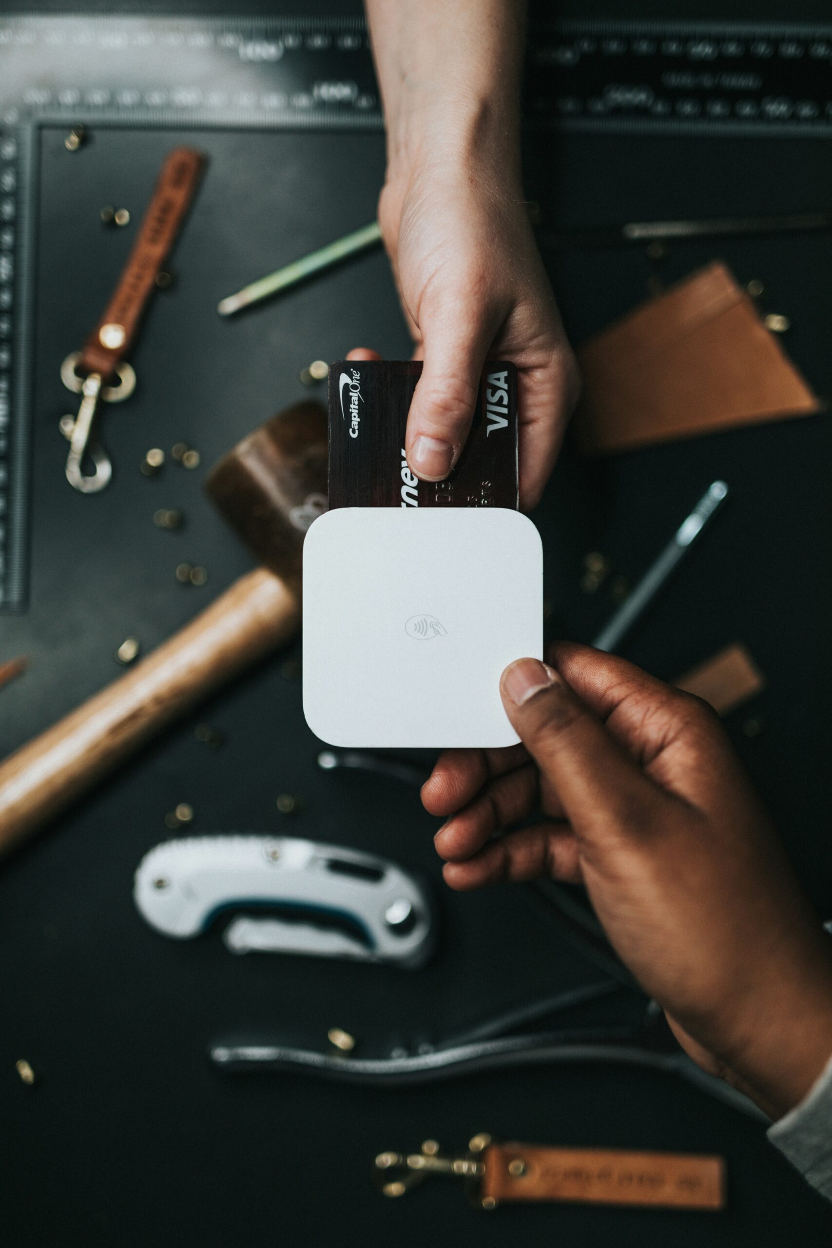 Guia Completo para Pagamento Seguro no AliExpress 1 person holding Visa card and white device